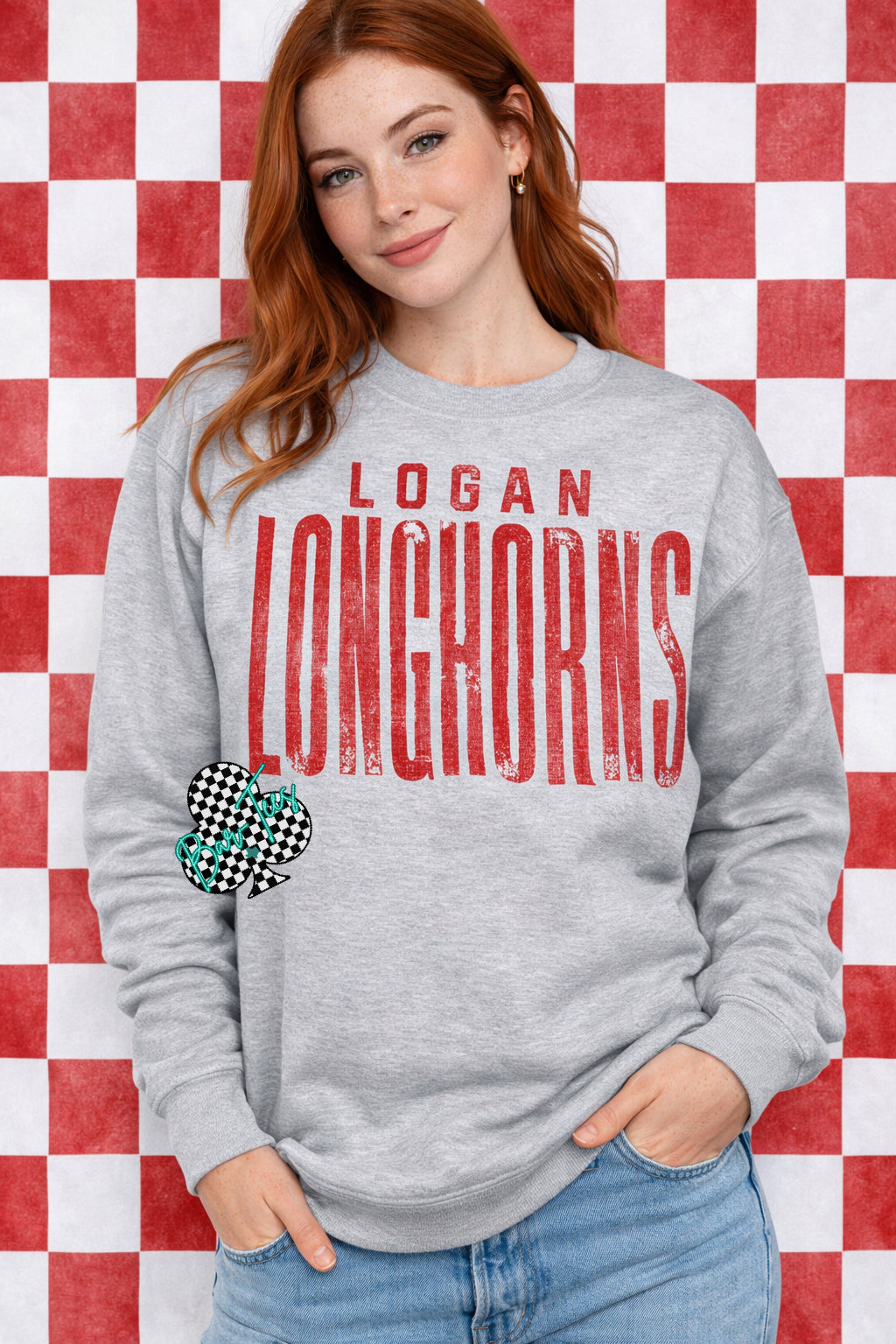 Person wearing a gray sweatshirt with 'Logan Longhorns' text against a red and white checkered background